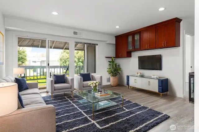 Staged..sunshine and amazing oak/cork flooring to covered deck