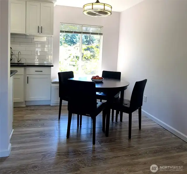Dining Nook showing oak/cork laminated flooring throughout the unit.