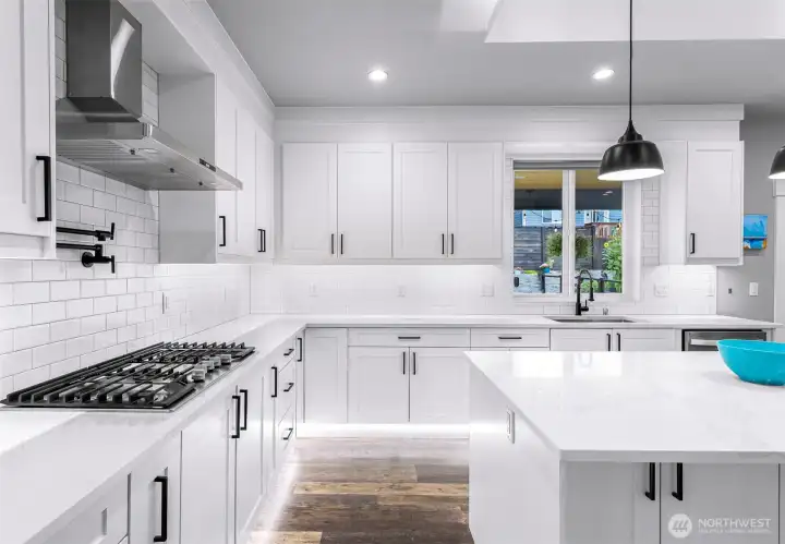 Gas range with in wall pot filler and lots of cabinets for storage