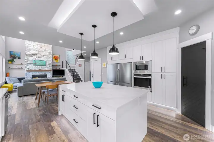 Large side by side fridge and freezer, wall oven, wall microwave and corner pantry