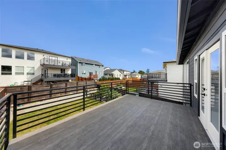 Primary bedroom deck perfect for enjoying a cup of coffee.