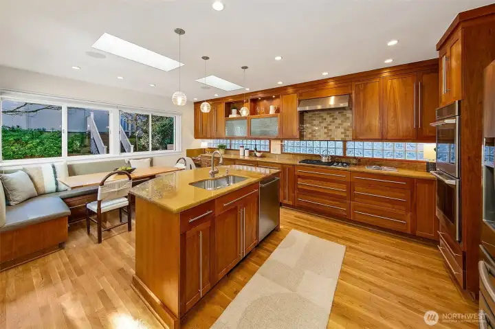 The kitchen was updated with wood cabinets running up to the ceiling, breakfast island and dining area