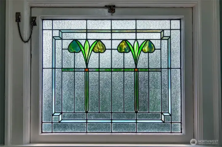 Well preserved lead and stained glass window allow light to gently filter into the 2nd floor landing.