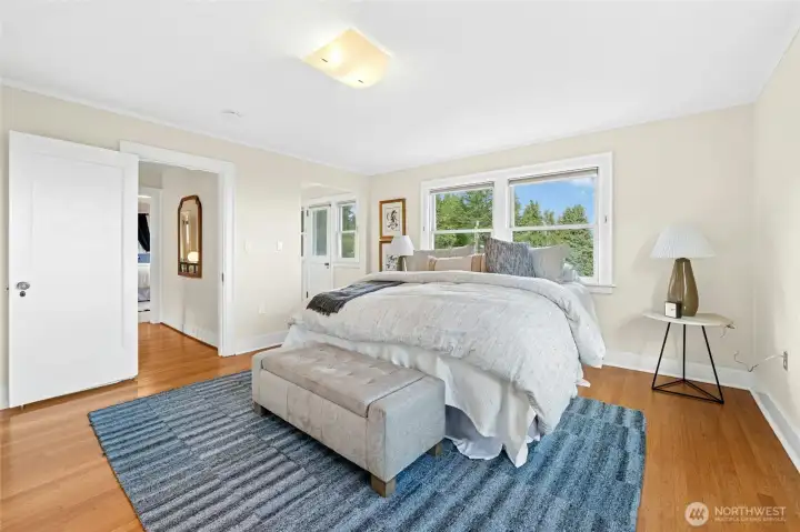 This image shows a walk-in wardrobe and door leading to a private balcony.