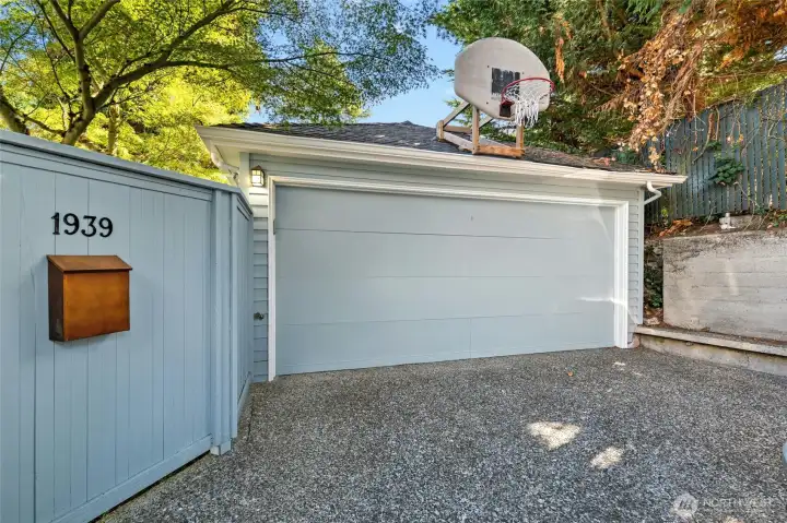 The detached one car garage in the alley.