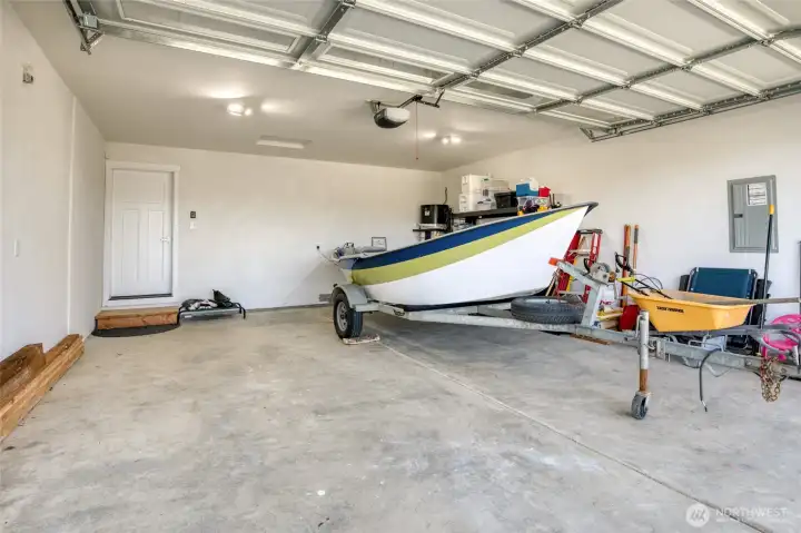 Extra high 12' foot garage door for those large trucks. This boat does not belong to the seller so not be conveyed with property.