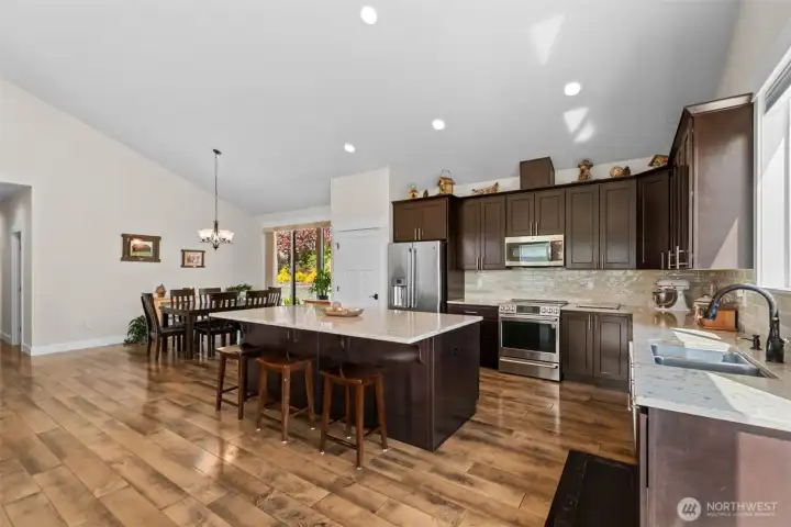 and an oversized island—flowing effortlessly into the living space