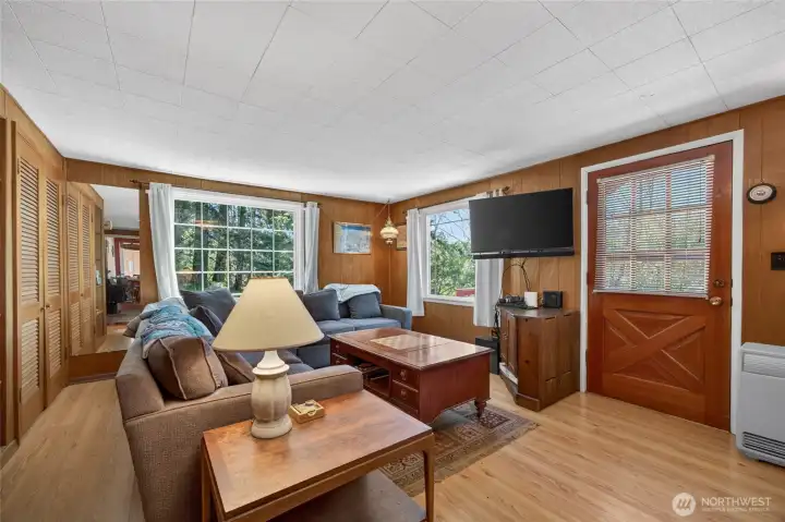 Natural light floods the comfy living room.