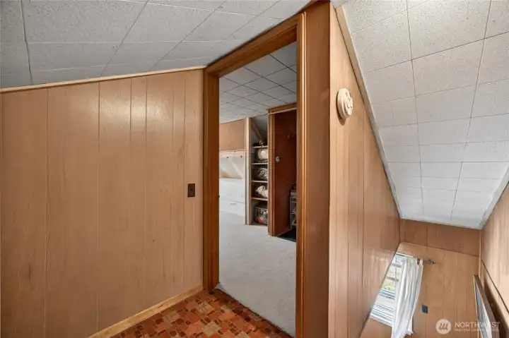 From the top of the stairs looking into the second floor bedroom.