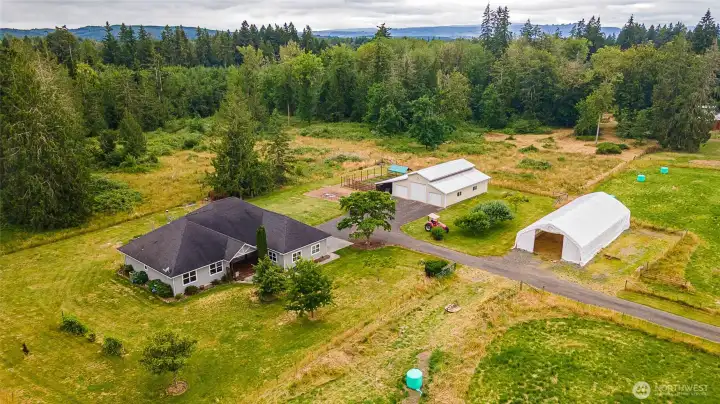Ariel view of home, garden, outbuildings, and hayfield & fenced pastures. Ariel view of home, garden, outbuildings, and hayfield & fenced pastures.