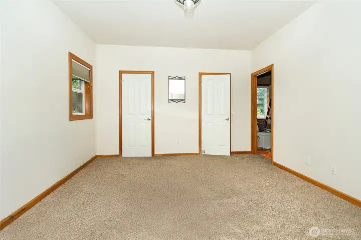 Primary suite. Closet has 2 separate doors to access full closet on either side. Primary bath is being refreshed with new tile floor and shower. Photos to come! Primary suite. Closet has 2 separate doors to access full closet on either side. Primary bath is being refreshed with new tile floor and shower. Photos to come!