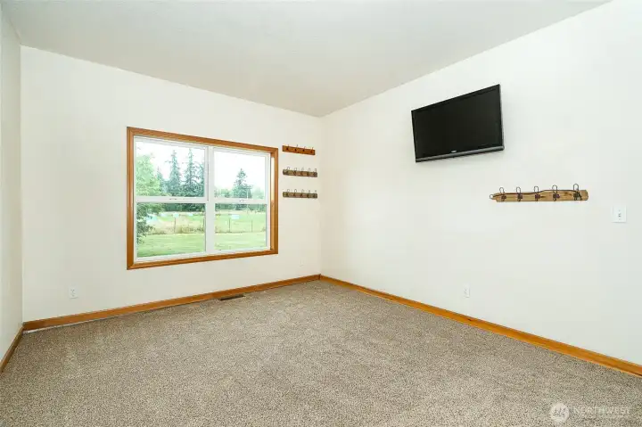 Bedroom #2, brand new carpet in a neutral color to go with any design. Large window brings in lots of natural light for a warm and inviting space for family and friends. Great view of the front yard and pasture. Bedroom #2, brand new carpet in a neutral color to go with any design. Large window brings in lots of natural light for a warm and inviting space for family and friends. Great view of the front yard and pasture.