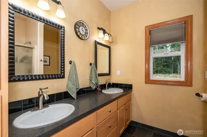 Main bathroom with double vanity and full shower. Beautiful tile flooring for an inviting space and easy maintenance. Main bathroom with double vanity and full shower. Beautiful tile flooring for an inviting space and easy maintenance.