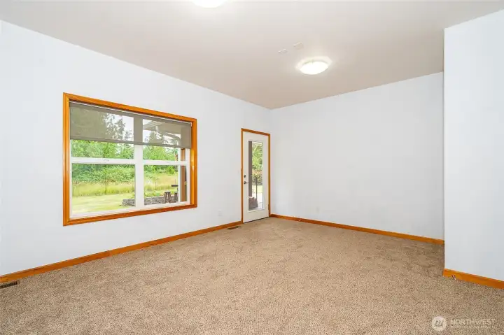 Large bonus room has an exterior door for easy access to the covered deck and patio area. Brand new carpet. What would you use this space for? Game room? Office? Craft room? Guest room with a Murphy bed? Endless possibilities! Large bonus room has an exterior door for easy access to the covered deck and patio area. Brand new carpet. What would you use this space for? Game room? Office? Craft room? Guest room with a Murphy bed? Endless possibilities!