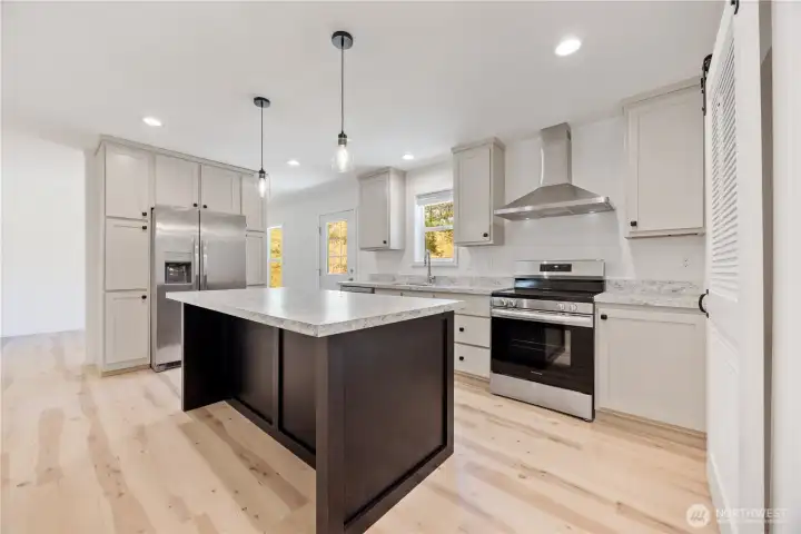 Light plays a huge part of what makes this a very workable kitchen and gathering area.
