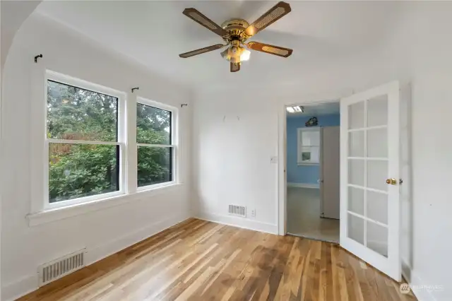 Dining room. original glass door to kitchen.