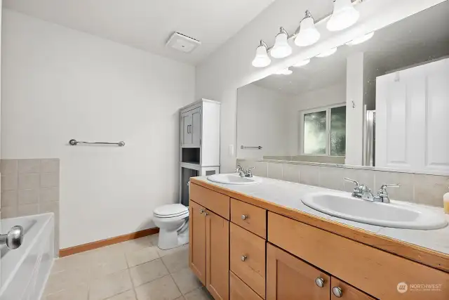 En-suite bathroom is generously sized and bright!