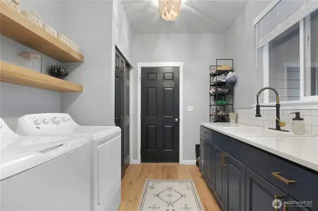 Main floor laundry/mud room has excellent storage and very functional layout