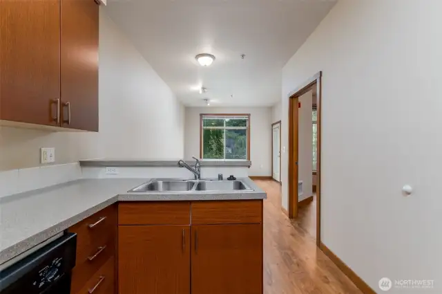 Kitchen is open and flows into living room