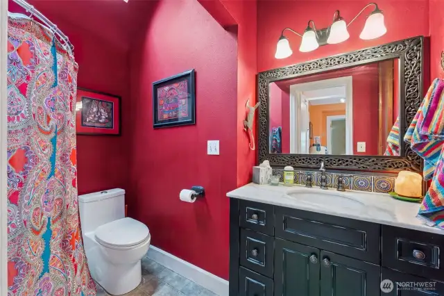 Main floor bath with vaulted ceiling and shower.