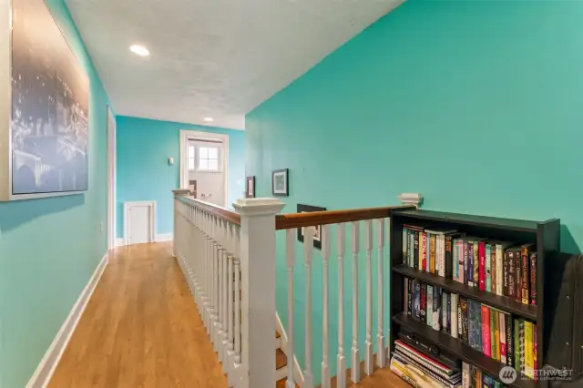 Upstairs hall with hardwood flooring