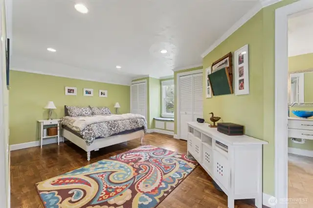 Primary bedroom upstairs is very spacious and features a window seat plus another small sitting area