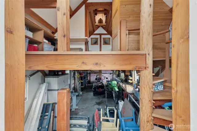 Stairs lead to a loft space that would be a perfect apartment/ADU getaway with a little work