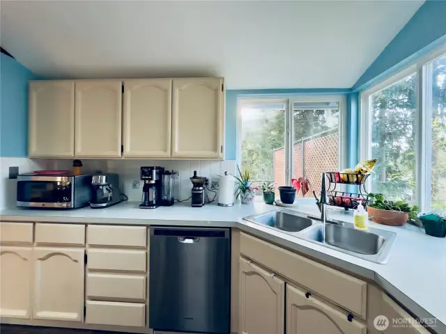 Kitchen is spacious with counter space and cabinets