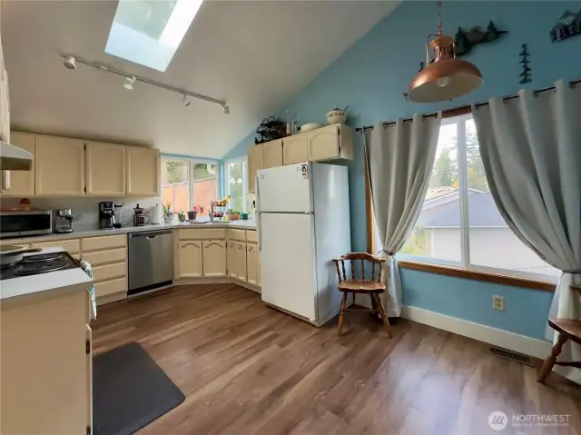 Kitchen has dine-in space that is light and bright