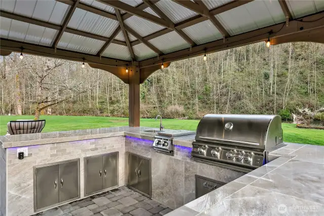 New, covered and lighted outdoor kitchen.