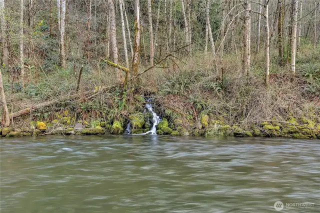 A waterfall view across the river.