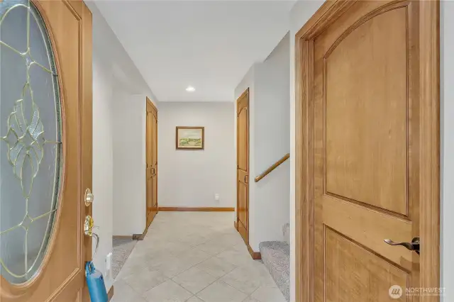 View of the entry way. Custom solid wood doors throughout the home.