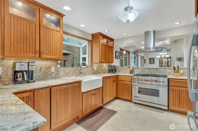 Chef's kitchen with Viking range, farm sink, custom cabinets and granite counter tops.