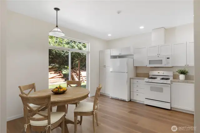 Enjoy a lovely view of trees, back patio and yard.