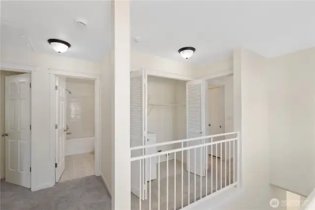 View to the full bath and laundry closet.