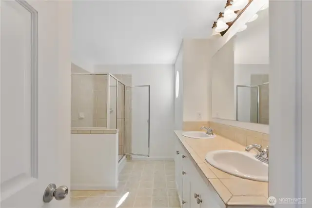 Primary ensuite bath w/ freshly painted cabinets.