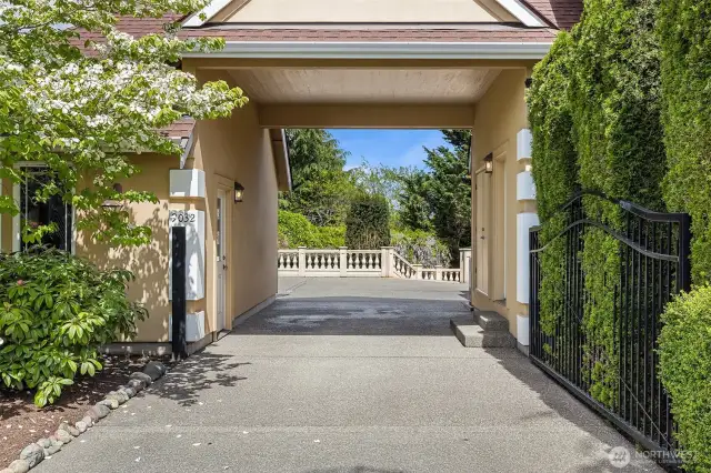 Through the gated porte cochere