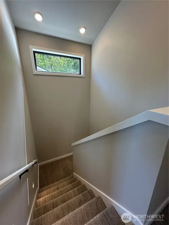 Stairwell with Transom Window for more Natural Light