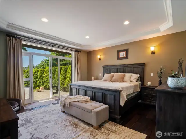 The primary bedroom suite enjoys beautiful views of the lake!