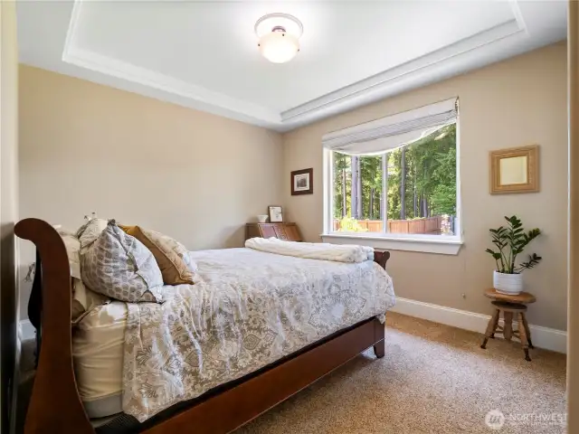 The second bedroom enjoys views of the lake.