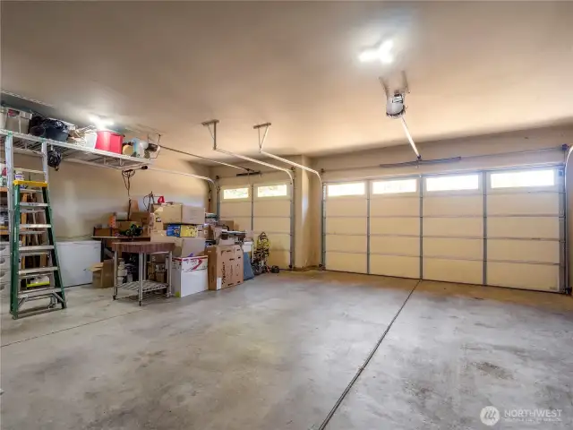 Three car garage with loads of storage space.