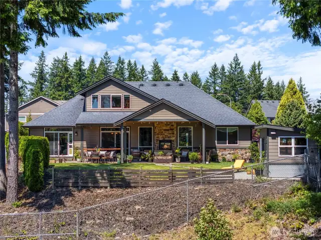 The beautifully landscaped backyard is the highlight of the home...