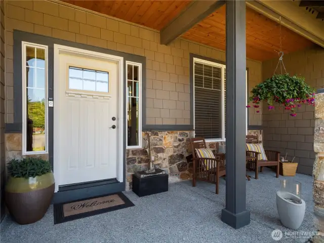 From the inviting covered front porch, step inside to luxury and comfort.