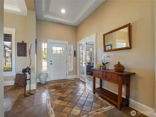 Gorgeous travertine tile throughout the entry, dining room, kitchen, bathrooms and hallways.