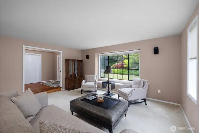 Large windows keep the formal living room light and bright.
