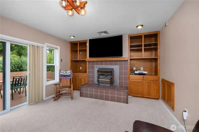 Access to the deck from the family room.  Gas fireplace and built in shelves.