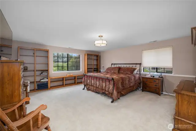 The primary suite is huge!  Built in shelves and large windows are a bonus!