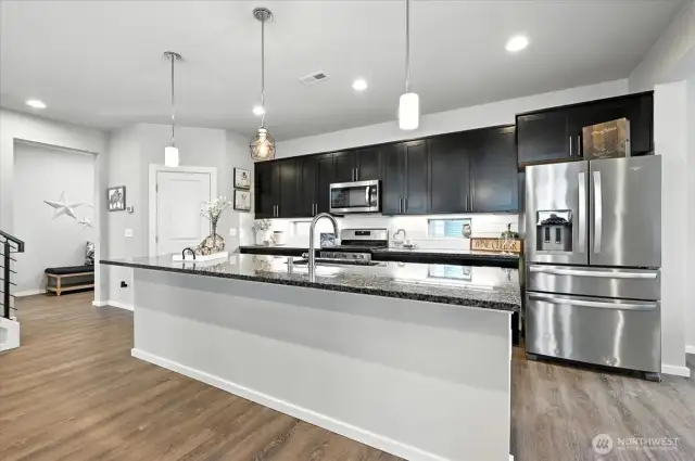 A spacious and stunning chef's kitchen featuring a large island-perfect for entertaining guests.