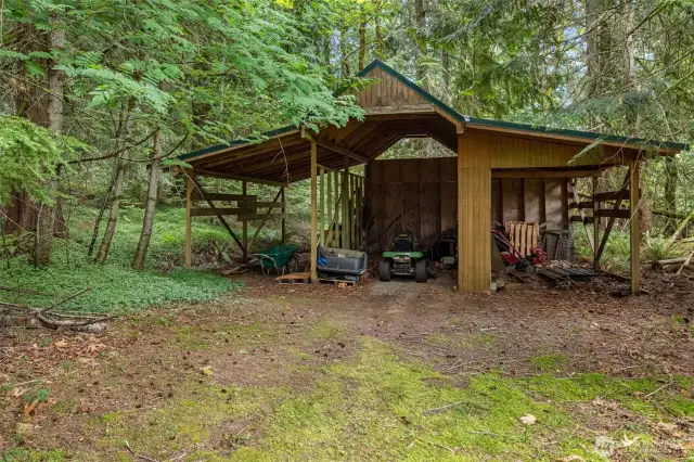 Outbuilding for riding lawn more and other yard tools.