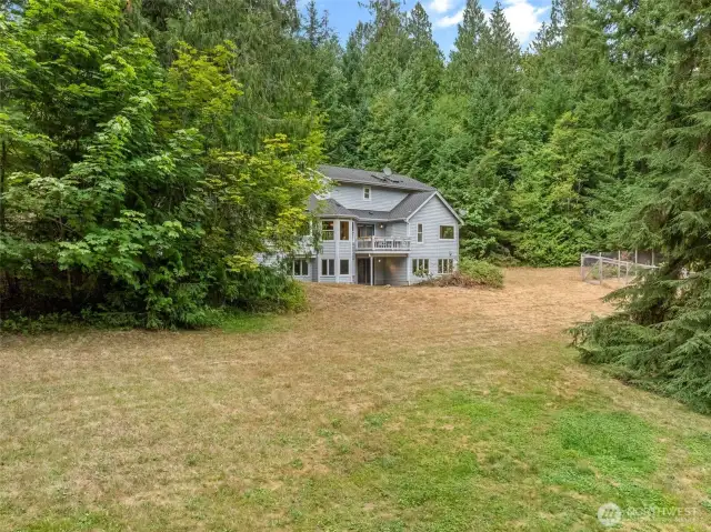 Beautiful, open space that is framed with wooded area.  Peace and tranquility just out the back door.